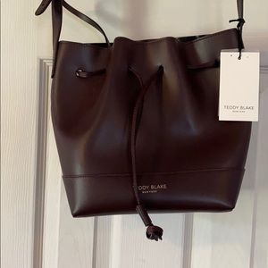 Teddy Blake Leather drawstring tote.